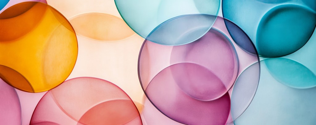 Abstract image of overlapping translucent circles representing layers of meaning and interpretation.